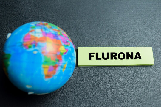 Concept of flurona write on sticky notes isolated on table.
