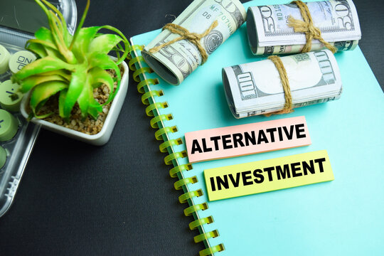 Concept of alternative investment write on sticky notes isolated on table.