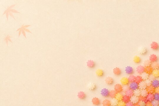 Autumn pastel konpeito with maple leaves and copy space