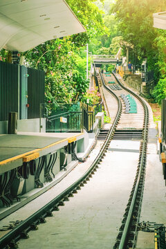 View of a funicular railway station near the peak in Hong Kong with tracks leading upward