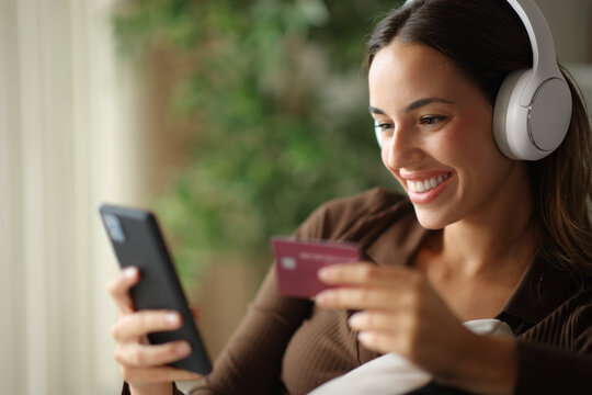 Happy woman paying online media using credit card