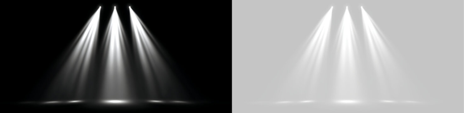 Three white stage spotlights casting downward light beams. Conical illumination effect isolated on black and transparent background