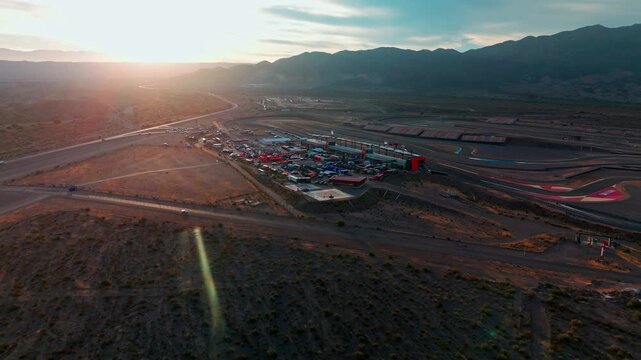 wide drone shot over service park parc ferme Circuito San Juan Villicum in argentina during sunset