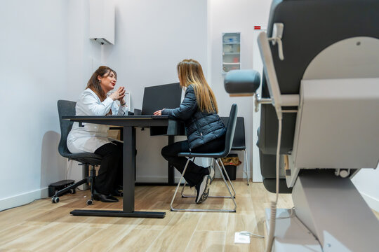 Doctor consulting patient about aesthetic beauty treatment in clinic