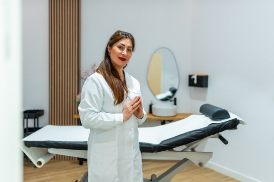 Female specialist standing in modern aesthetic clinic
