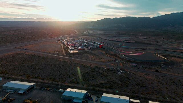 right side wide drone shot over service park parc ferme Circuito San Juan Villicum in argentina during sunset