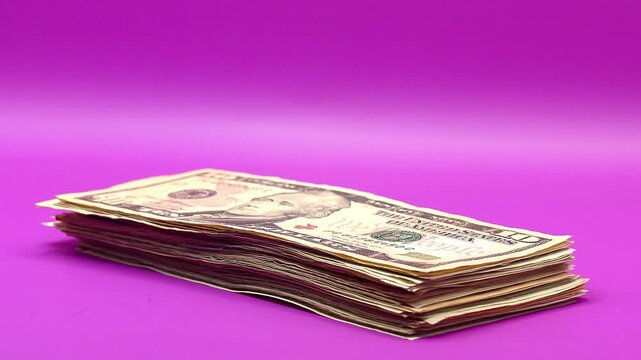 US dollar banknotes growing layer by layer on vibrant pink isolated background for creative financial marketing modern budget concepts and stylish money visuals