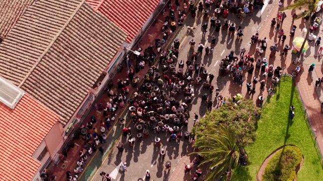 Aerial view of indigenous people celebrating the inti raymi festival on the streets of cotacachi