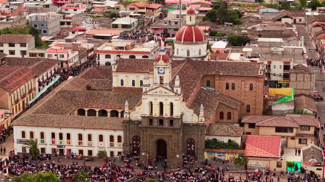 Aerial view of a crowd celebrating the inti raymi festival in the main square of cotacachi