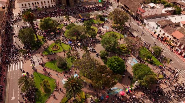 Aerial view of a crowded traditional inti raymi festival parade in cotacachi's main square