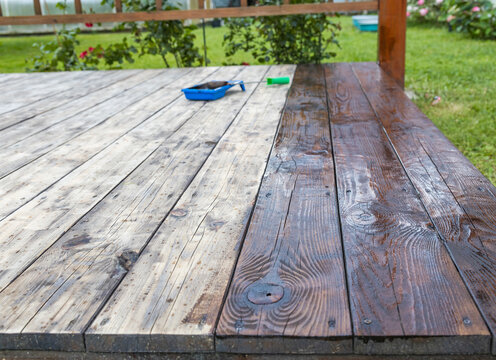 Wooden deck with half stained, half natural finish
