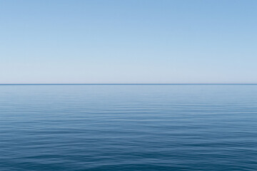 Fototapeta premium Calm Endless Blue Sea Horizon Under Clear Sky