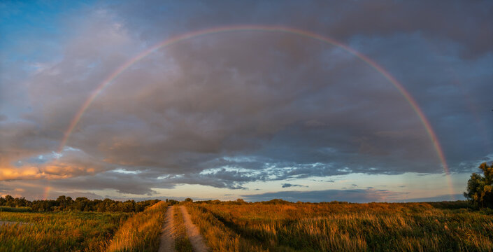 A magnificent and beautiful rainbow after an evening rainfall
