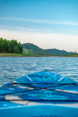 Blue Patterned Inflatable Paddleboard Nose on Lake