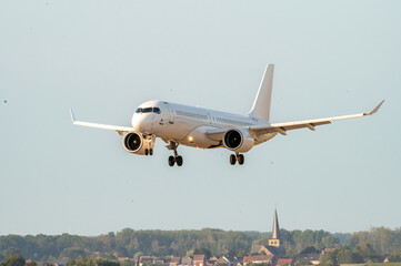 Fototapeta premium Passenger Aircraft on Short Final Over the Field