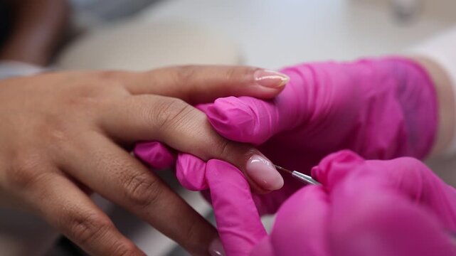 Nail salon process with close-up shots of nail care and painting at a local salon