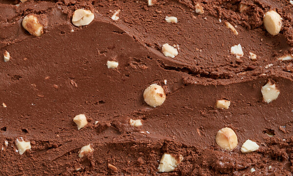 Rich chocolate ice cream texture, macadamia nuts, white chocolate chunks.