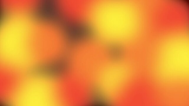 Abstract warm bokeh lights flickering on black background