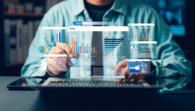 Business analyst using a laptop to analyze financial data, business intelligence dashboards, charts, and digital analytics for strategic planning,
