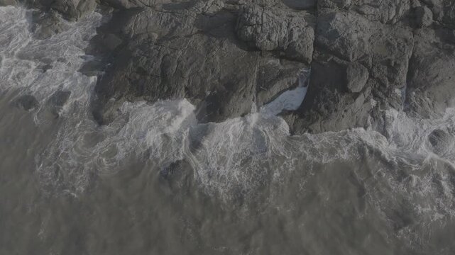 Aerial drone view of Mui Ne fishing village and Ganh Da Mui Ne coastline in Lam Dong, Vietnam, with fishing boats at sea, sandy beaches and a scenic coastal landscape.