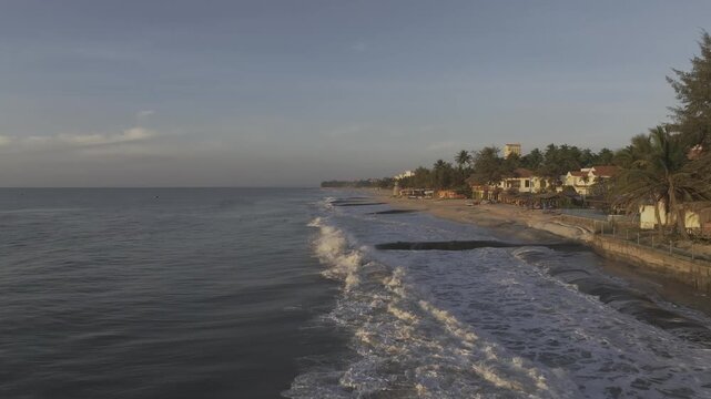 Aerial drone view along Ham Tien Beach in Mui Ne, Lam Dong, Vietnam, showcasing the tropical coastline, sandy beach, turquoise sea and scenic seaside landscape.