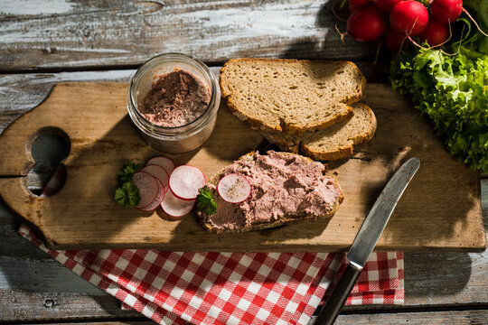 Liverwurst spread on slice of brown bread
