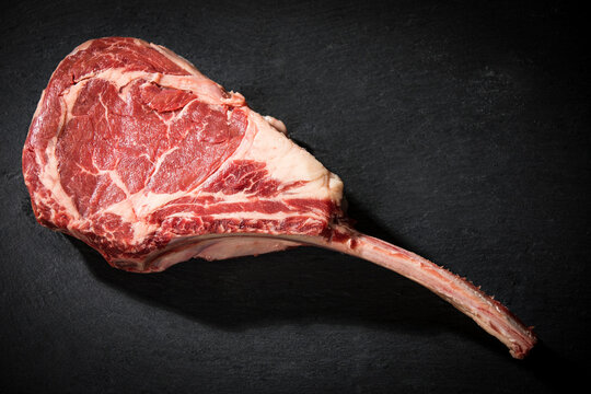 Raw tomahawk steak