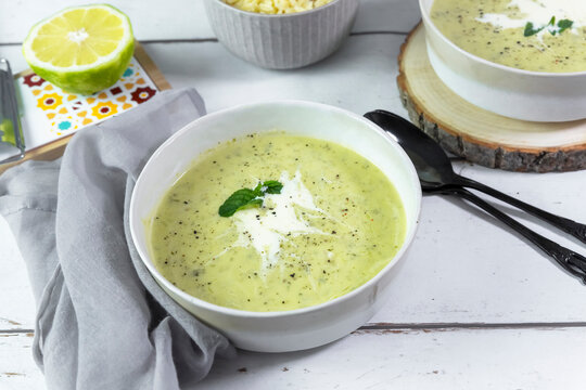 Creamy lemon zucchini soup with fresh herb and orzo pasta