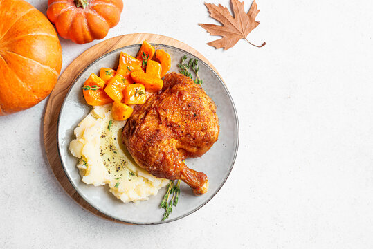 Autumn meal: roasted chicken with glazed pumpkin and mashed potato