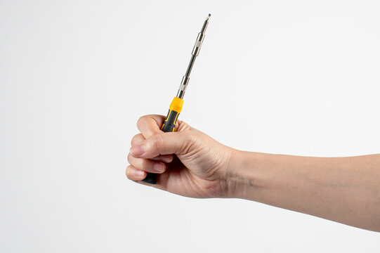 A screwdriver tools and hand on white background
