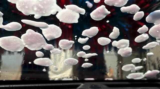 Car Wash Front Windshield View Slow Motion 4K 120fps, Automated Car Wash Machine Brushes Soap Water Cleansing Vehicle Glass Detail