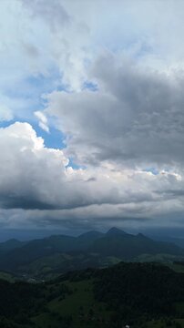 Vertical Aerial View of Mountain Range and Clouds Before Rain