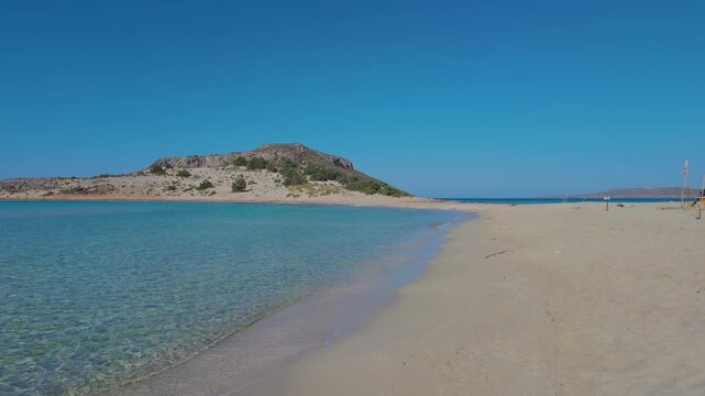 Discover the stunning beauty of Simos Beach on Elafonisos Island Greece. Enjoy the serene turquoise waters and soft golden sands under a radiant blue sky, perfect for relaxation and adventure.