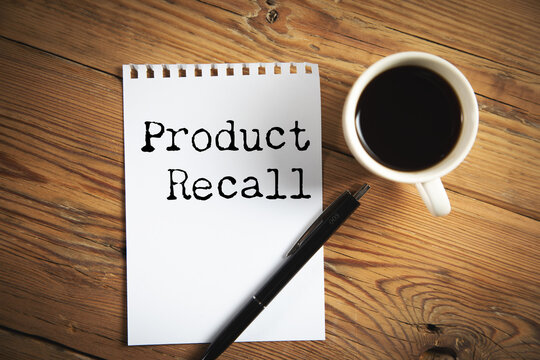 A notebook with product recall text