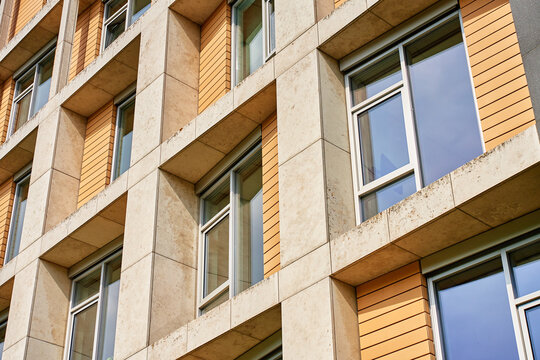 Building facade with concrete frames and rows of windows