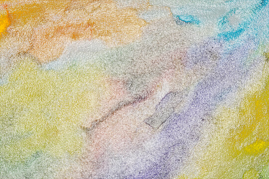 Abstract watercolor wash texture with yellow, blue, and purple hues, subtle granulation and
