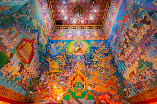 Exquisite wall mural painting inside Wat Sri Uthumphon in Mueang Nakhon Sawan District, Nakhon Sawan, Thailand, depicting vibrant Buddhist legends, deities, and detailed traditional Thai artwork.
