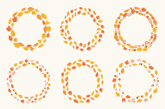 Six circular autumn wreaths made of flat leaves, acorns and berries framing blank round space, symbolizing the cozy fall season and festive harvest greetings
