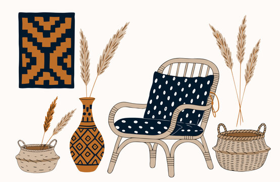Afrohemian decor with rattan chair, patterned cushion, woven baskets, ceramic vase and dried grasses in a warm afro-boho interior style