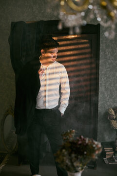 Caucasian actor practices monologue before vintage mirror