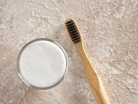 Bamboo toothbrush and baking soda for natural oral care
