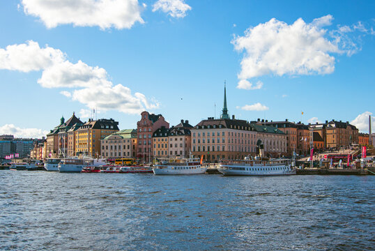 Skeppsbron waterfront with H&ocirc;tel Reisen, Sj&ouml;fartshuset, Brandstodsbolagets hus, Sutthoffska palatset, Tyska kyrkan and Kungliga Myntkabinettet in Stockholm