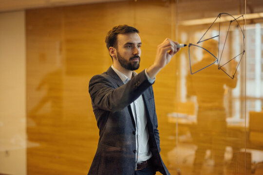 Business Professional Planning AI Strategy on Glass Board