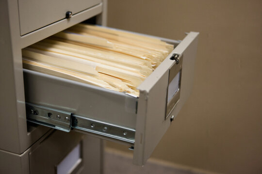 Open Metal Filing Cabinet Drawer with File Folders