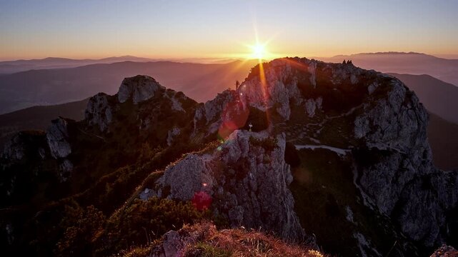 Timelapse of Sunrise Over Rocky Mountain Peak with Camera Tilt Up