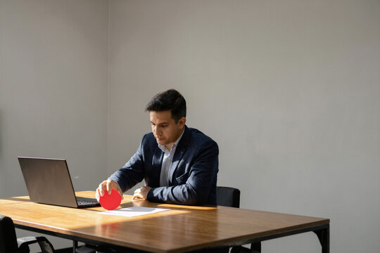 Executive placing a red decision marker on a meeting table