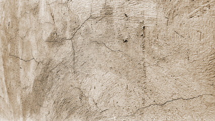 Cracked cream stucco wall texture with a rough plaster surface. © STP PICTURE