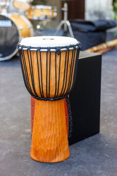  African hand-carved djembe drum and wooden flamenco box drum.