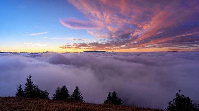 Morning Timelapse of Colorful Sunrise Over Cloud Inversion from Mountain Viewpoint