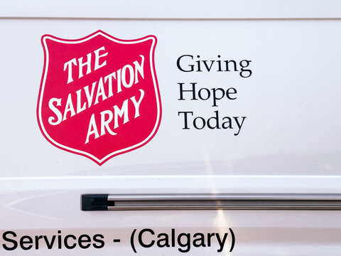Calgary, Alberta, Canada. August 23, 2026. Close-up of The Salvation Army logo and motto printed on the side of a white service vehicle.